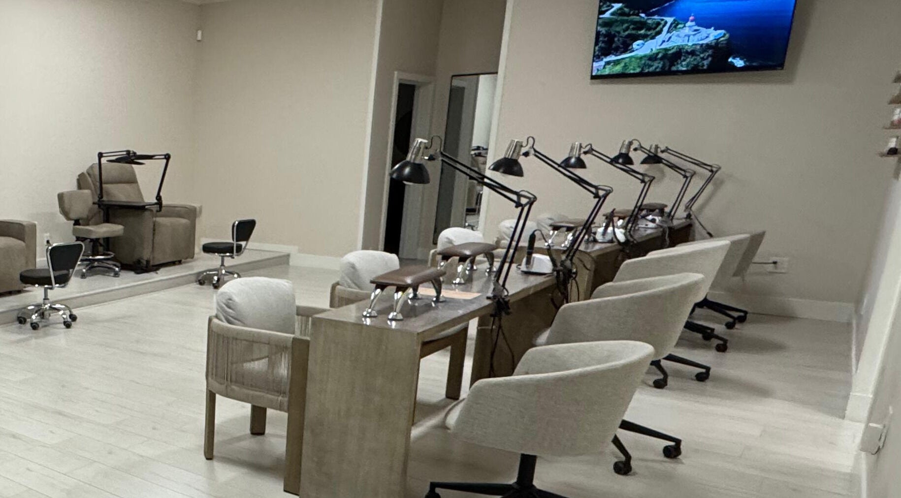 Elegant interior of Amitie Beaute Bar, a salon in Los Angeles, California, US, featuring cozy nail stations.