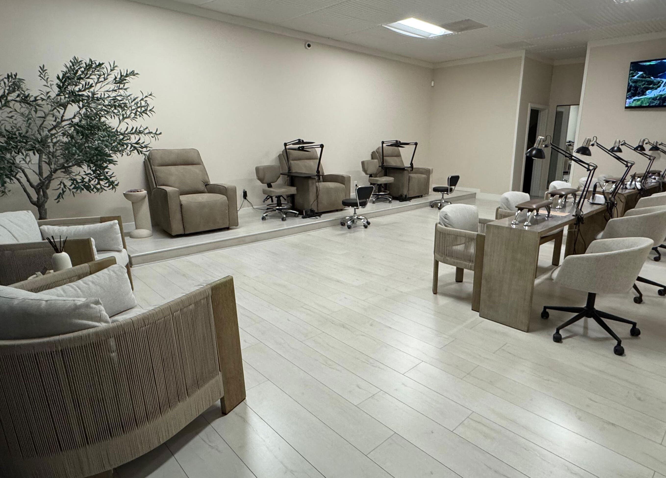 Chic interior of Amitie Beaute Bar in Los Angeles, California, US with modern seating and nail stations.