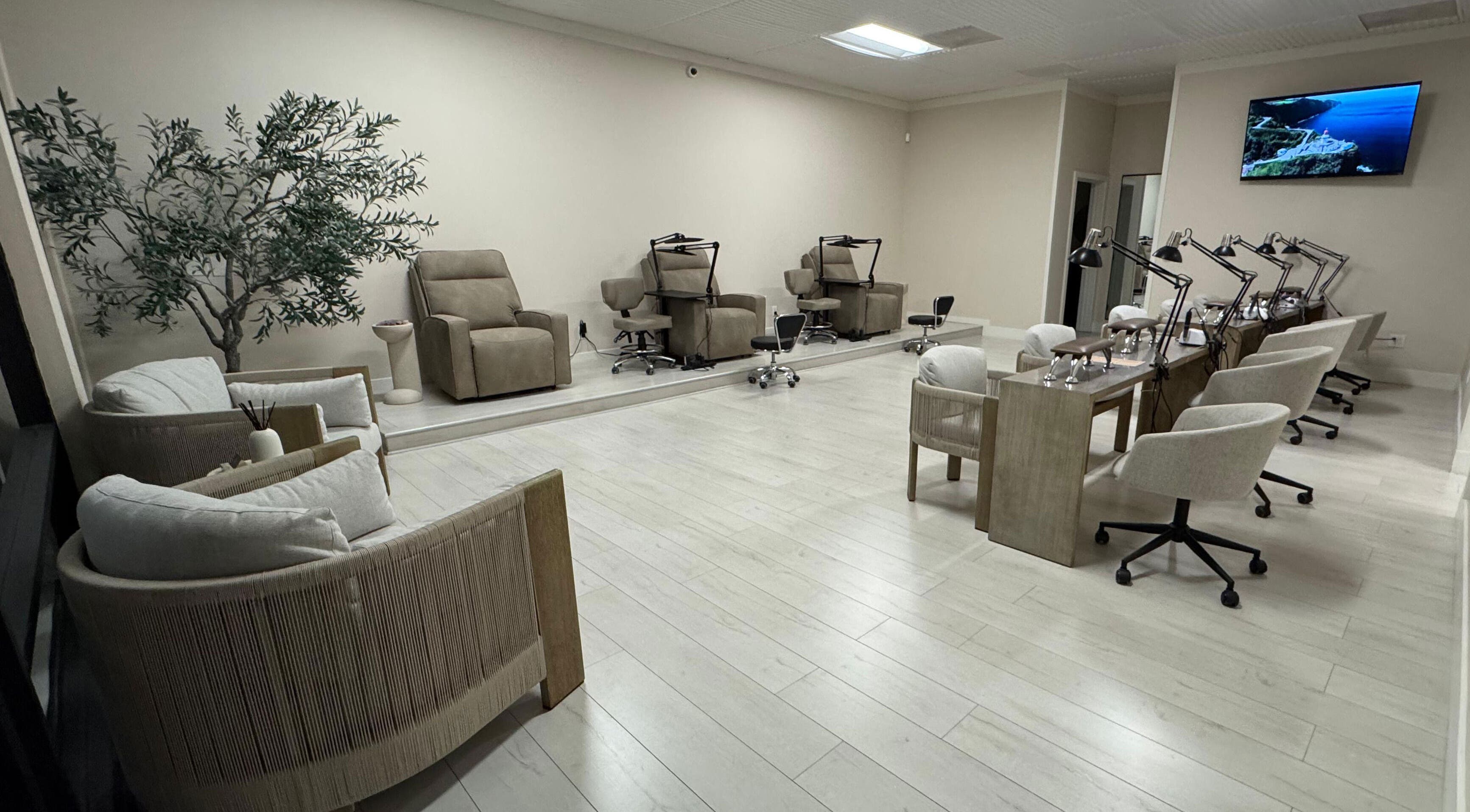 Chic interior of Amitie Beaute Bar in Los Angeles, California, US with modern seating and nail stations.