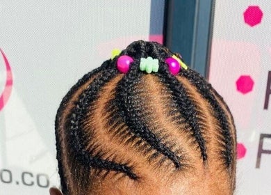 Stylish braided hairstyle with colorful beads at Prettykidshairdo, Pretoria, Gauteng, ZA.