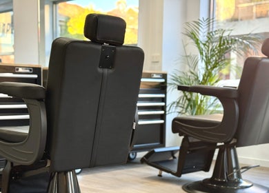 Modern barber chairs at Victory Lap Barbershop, Melbourne, Victoria, AU offer style and comfort.