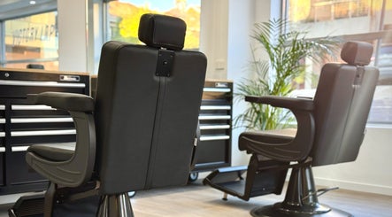 Modern barber chairs at Victory Lap Barbershop, Melbourne, Victoria, AU offer style and comfort.