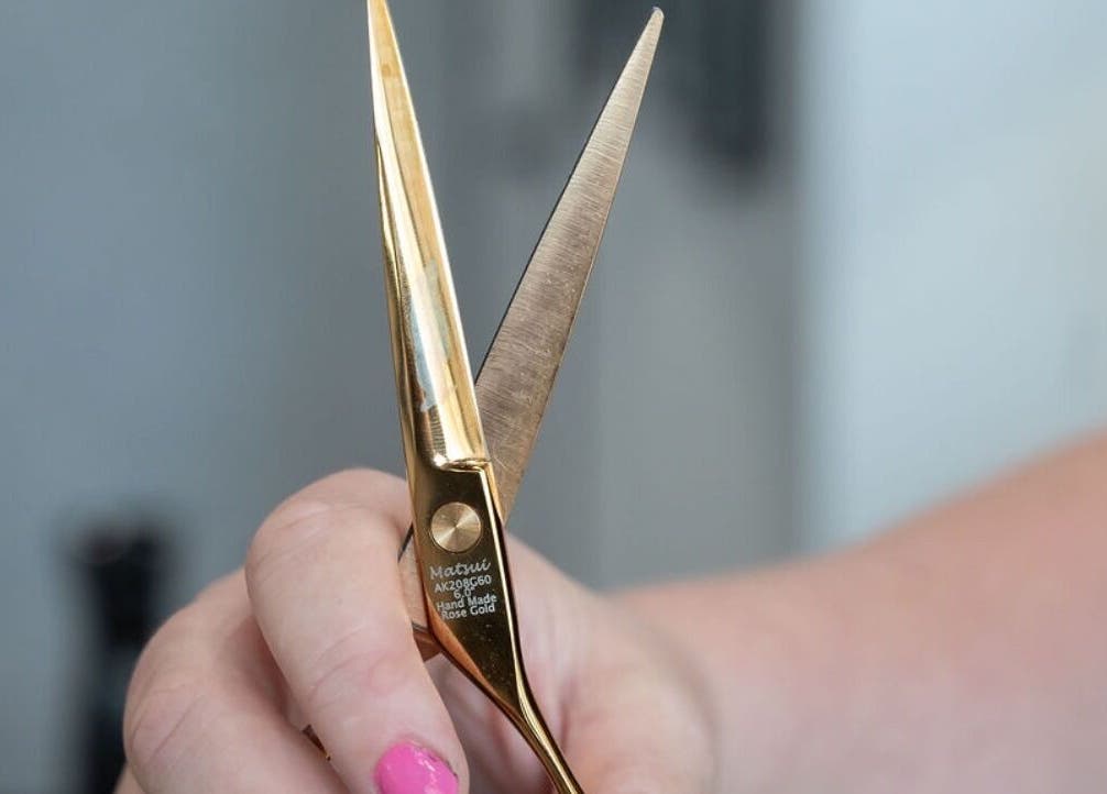 Rose-gold hair shears at Noho Hair & Co., Ormeau, Queensland, AU, showcasing precision and style.
