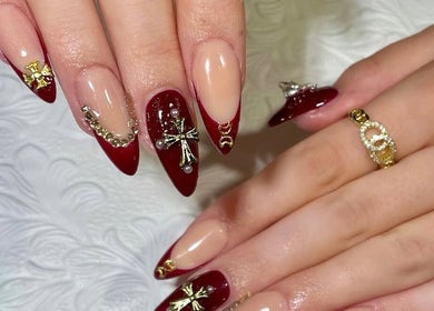 Stylish red and gold nail art at EM nail & beauty, Bray, County Wicklow, IE.