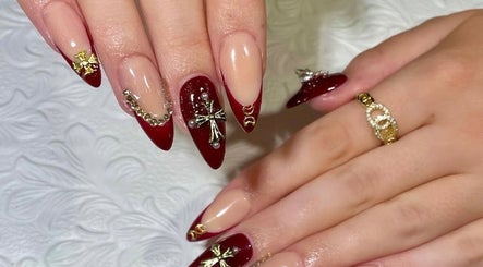 Stylish red and gold nail art at EM nail & beauty, Bray, County Wicklow, IE.