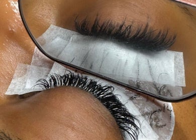 Close-up of eyelash extensions being applied at Nicki Does Beauty in Bristol, England, GB.