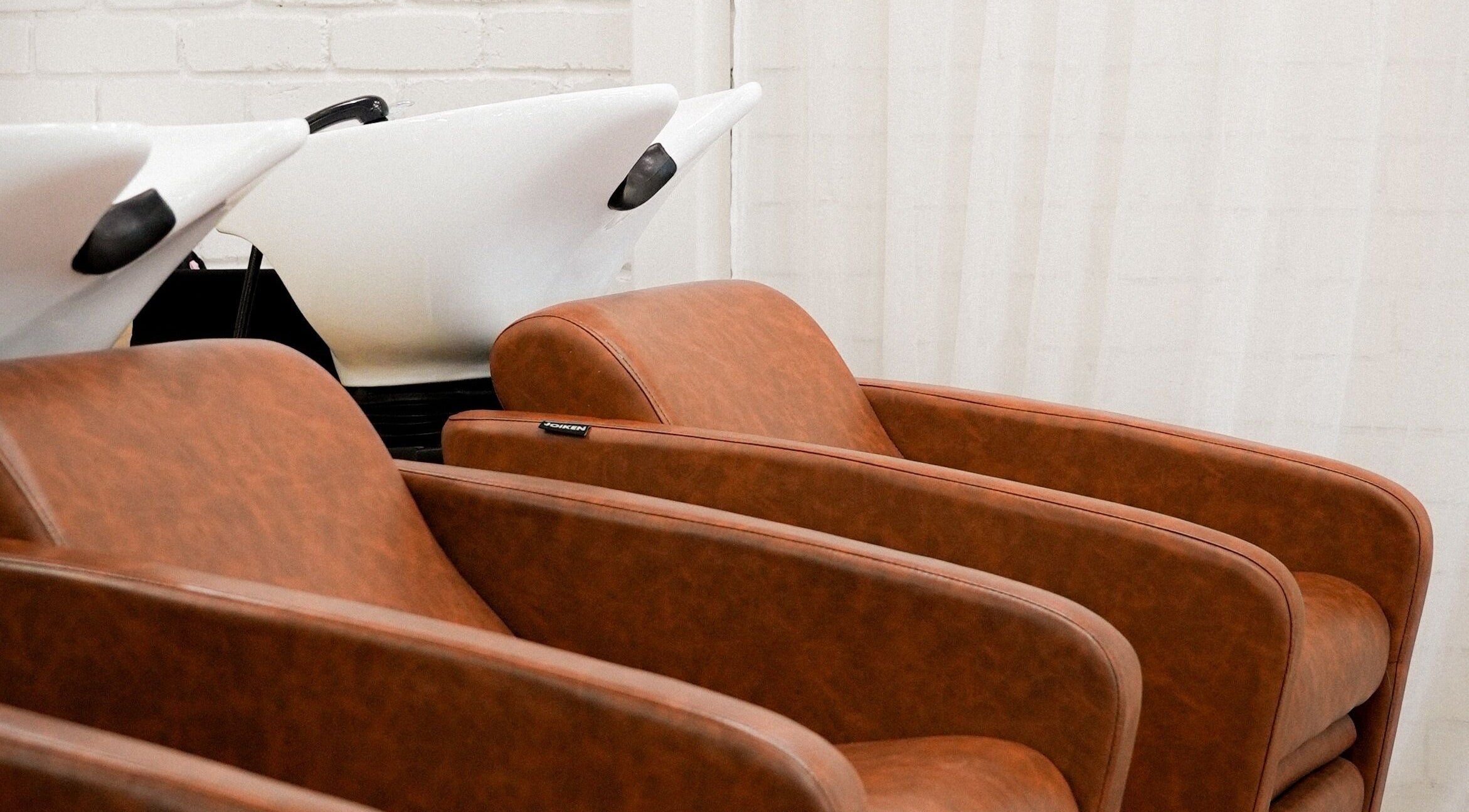 Stylish salon wash stations at Hair by Neomai - WARRAGUL, Warragul, Victoria, AU. Luxurious seating for comfort.