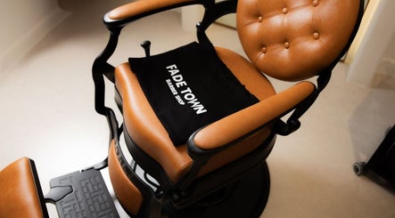 Luxury barber chair at Fadetown in Riyadh, Riyadh Province, SA, showcasing premium style and comfort.