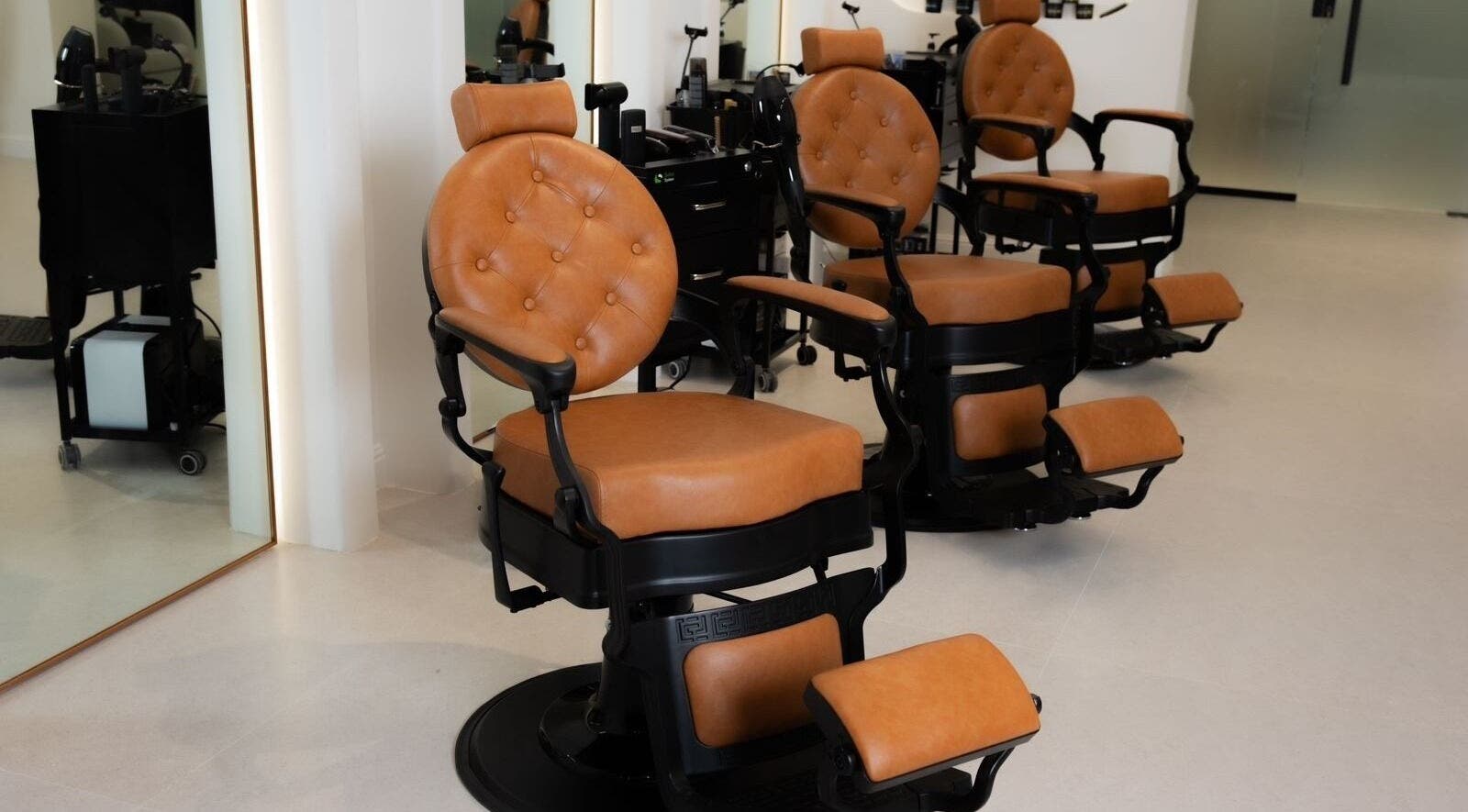 Luxurious barber chairs at Fadetown, Riyadh, Riyadh Province, SA, showcasing premium comfort and style.