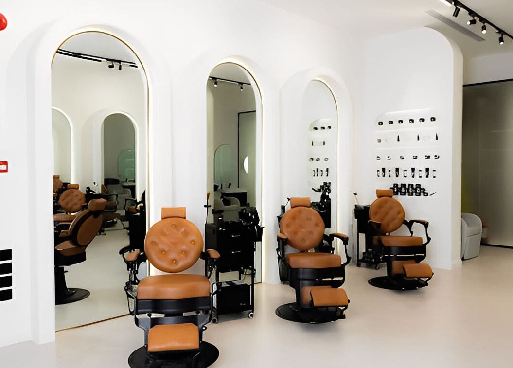 Modern beauty salon at Fadetown, Riyadh, Riyadh Province, SA with sleek chairs and mirrors.