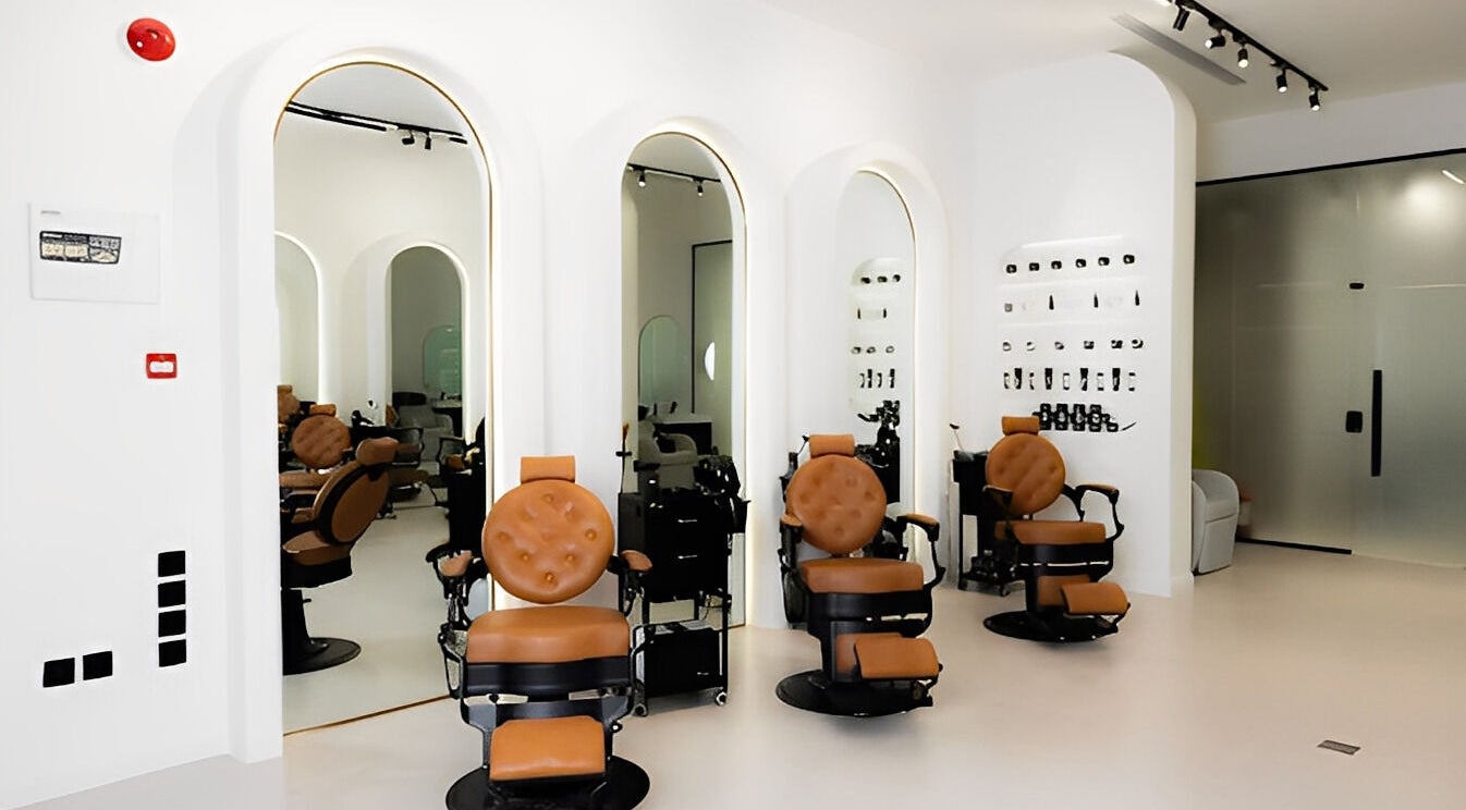 Modern beauty salon at Fadetown, Riyadh, Riyadh Province, SA with sleek chairs and mirrors.