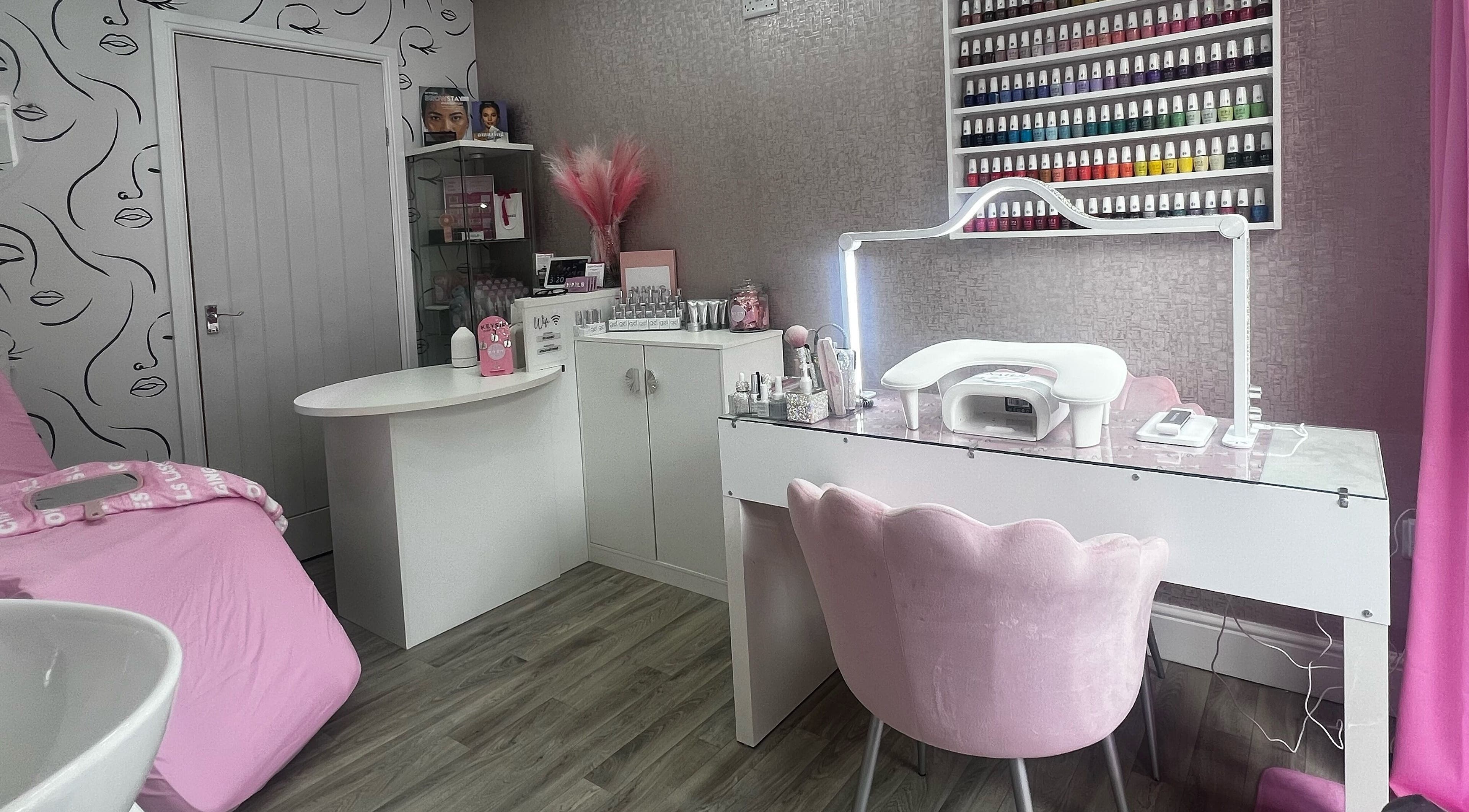Chic interior of Beauty By Amanda in Fforest-fach, Wales, GB showcasing nail polish display and beauty stations.