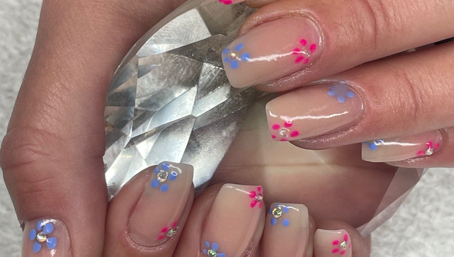 Floral nail art with crystal accents at Beauty Authentic Oasis, Pretoria, Gauteng, ZA.