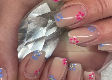 Floral nail art with crystal accents at Beauty Authentic Oasis, Pretoria, Gauteng, ZA.