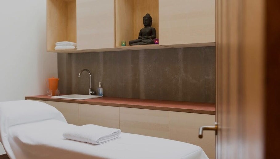 Elegant spa room at By Adriane Roman in London, England, GB with a massage bed and calming decor.