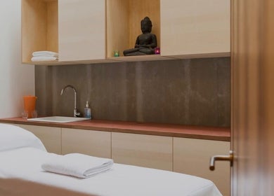 Elegant spa room at By Adriane Roman in London, England, GB with a massage bed and calming decor.