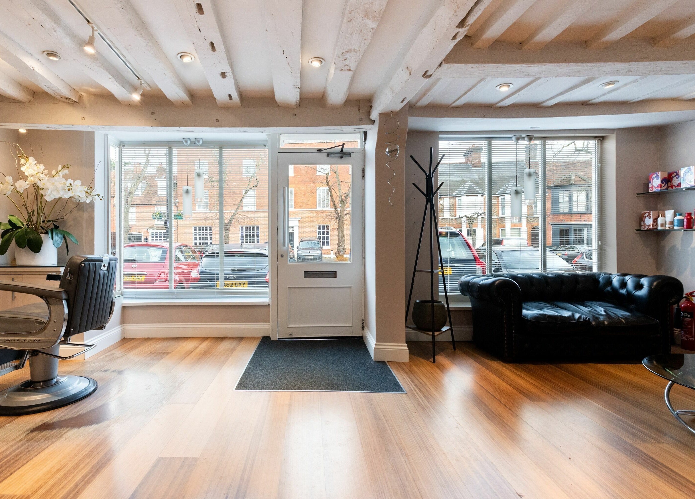 Bright and stylish seating area at Albemarle Haircutters, Beaconsfield, England, GB.