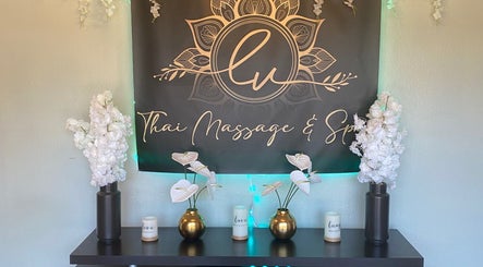 Entrance decor at LV Thai Massage & Spa in Las Vegas, Nevada, US with elegant floral arrangements and candles.