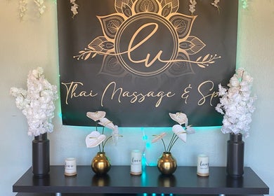 Elegant decor at LV Thai Massage & Spa in Las Vegas, Nevada showcasing white flowers and gold vases.