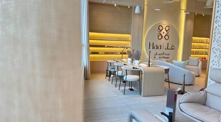 Chic interior of Haa Beauty House in Al Khobar, Eastern Province, SA with modern seating and warm lighting.