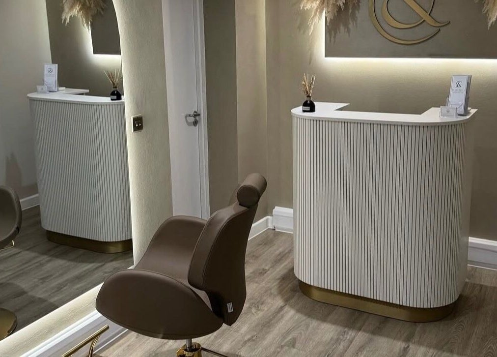 Stylish salon interior at Blushed Bykyra, Upton, England, GB featuring sleek seating and elegant decor.