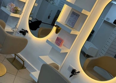 Elegant salon station at Inside Out Hair Beauty Wellness, Seaham, England, GB, featuring soft lighting and chic decor.