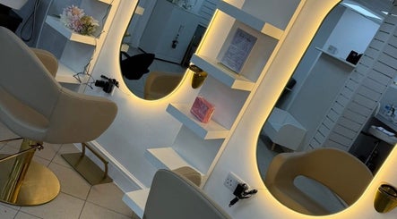 Elegant salon station at Inside Out Hair Beauty Wellness, Seaham, England, GB, featuring soft lighting and chic decor.