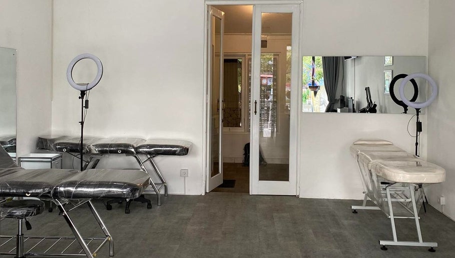Tattoo and piercing room at Kama Piercing & Tattoo Bali, featuring clean aesthetics. Located in Bali, Bali, ID.