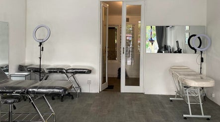 Tattoo and piercing room at Kama Piercing & Tattoo Bali, featuring clean aesthetics. Located in Bali, Bali, ID.