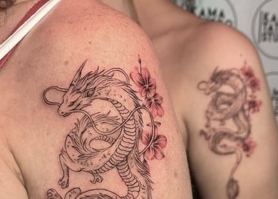 Intricate dragon tattoos on shoulders at Kama Piercing & Tattoo Bali, Bali, ID.