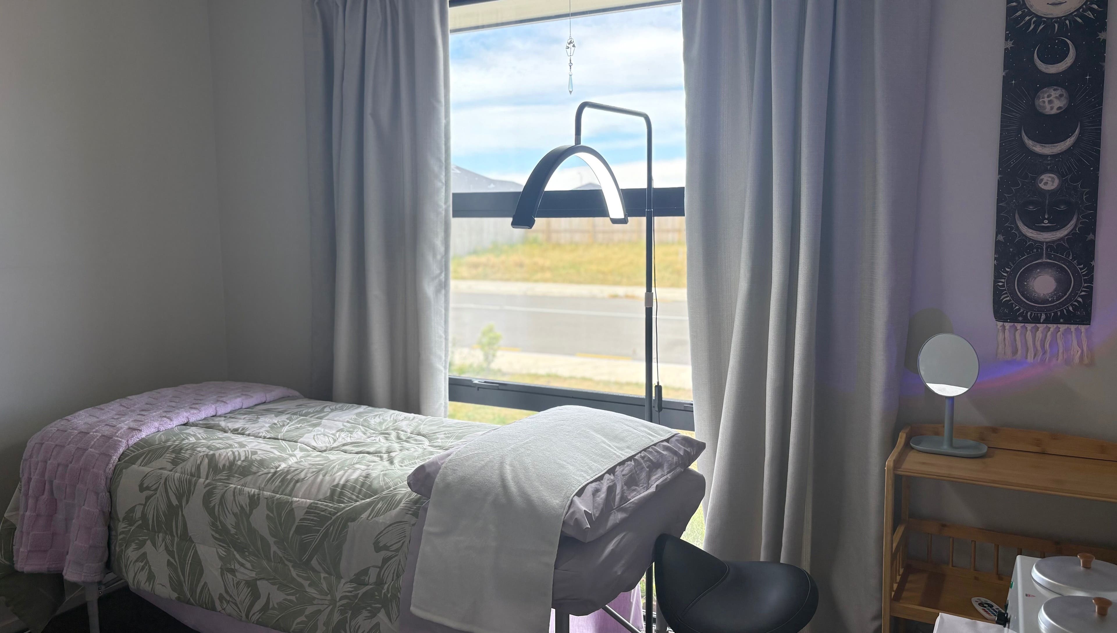 Cozy treatment room at Glow Therapy - Beauty by Teresa in Woodend, Canterbury Region, NZ with natural light.