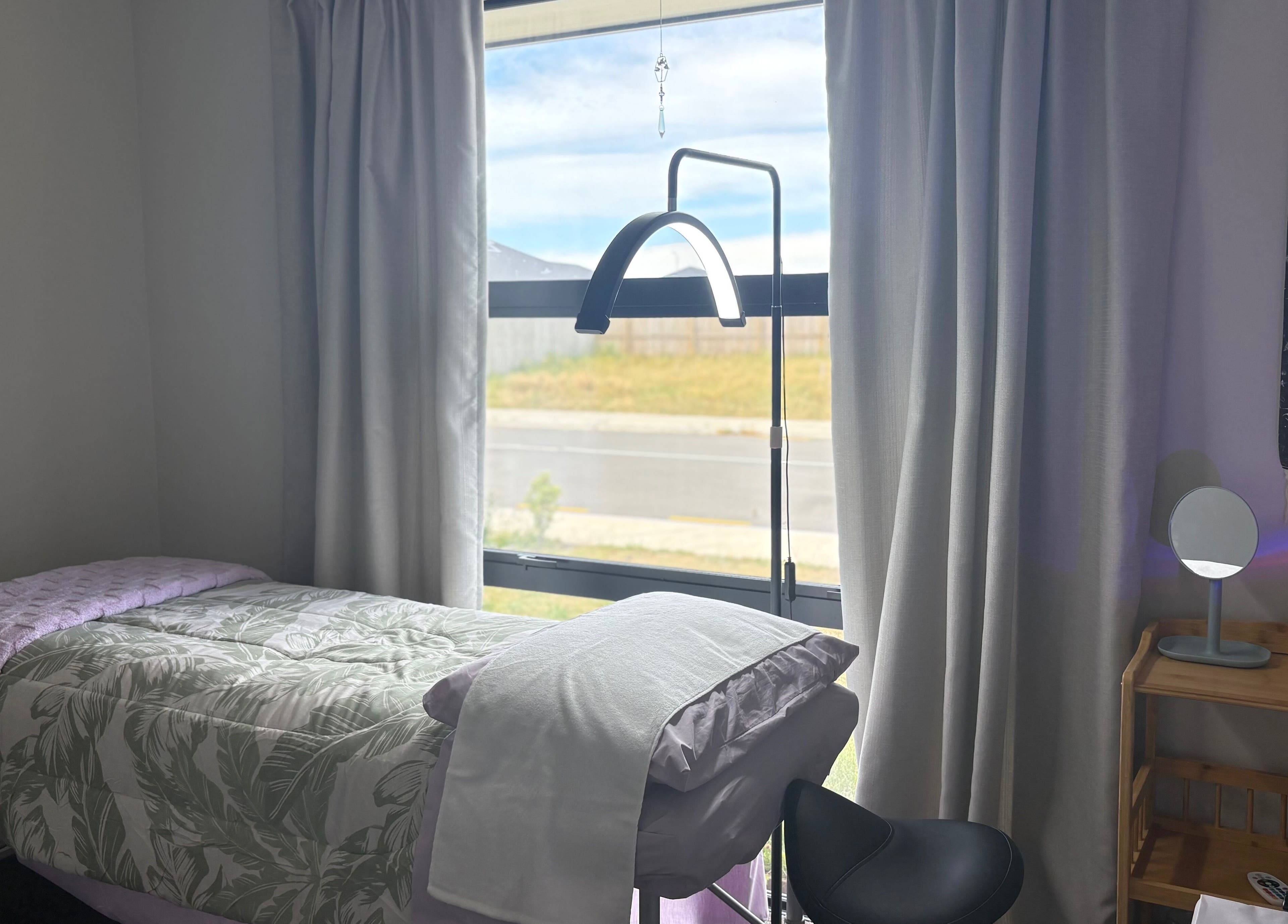 Cozy treatment room at Glow Therapy - Beauty by Teresa in Woodend, Canterbury Region, NZ with natural light.