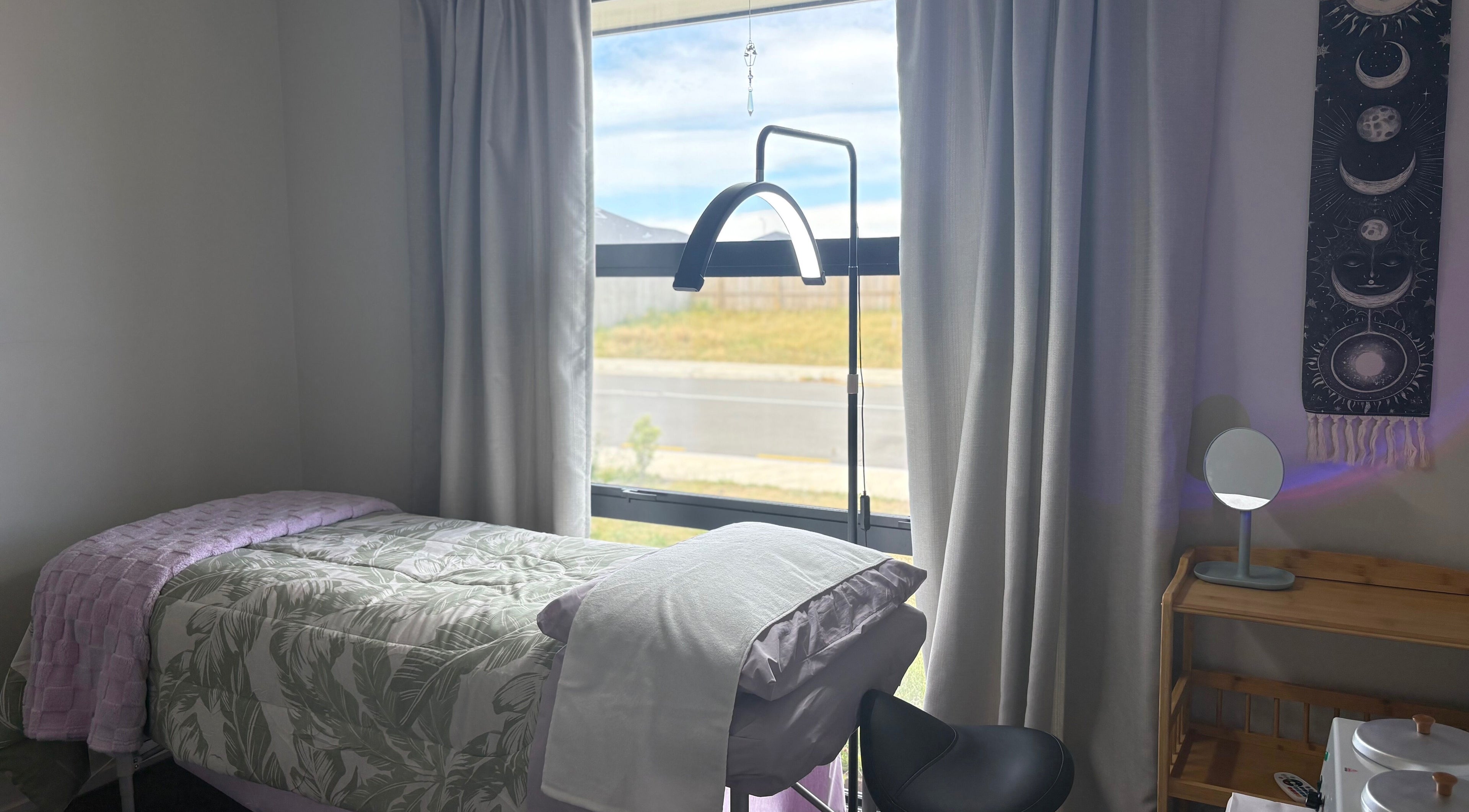Cozy treatment room at Glow Therapy - Beauty by Teresa in Woodend, Canterbury Region, NZ with natural light.