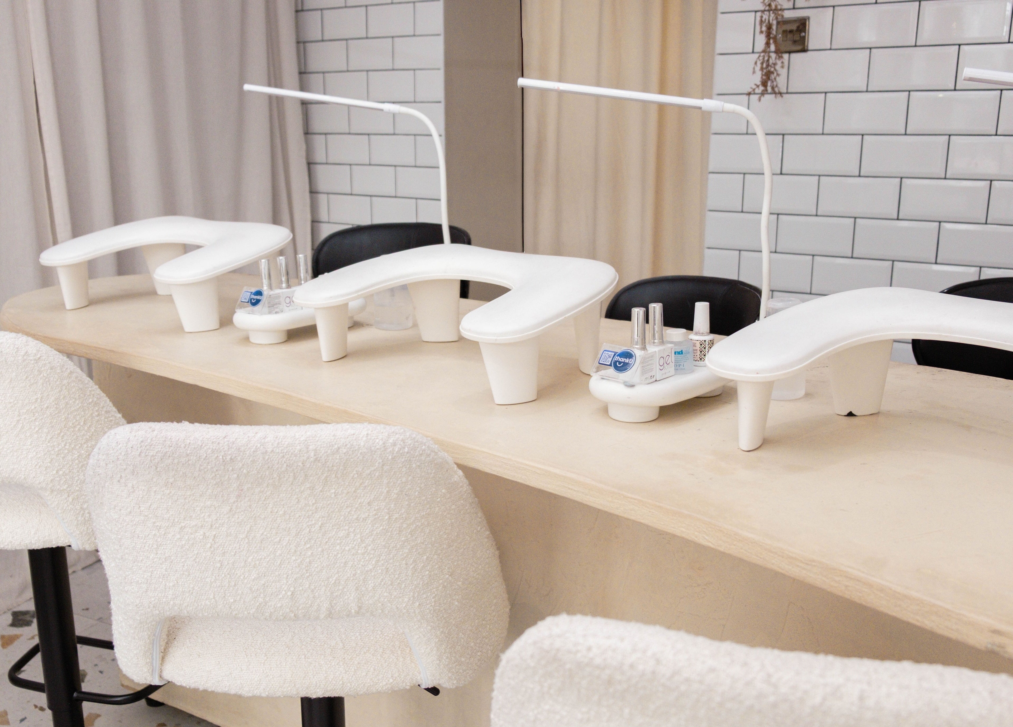 Modern nail studio setup at Awe London Shoreditch in London, England, GB with cozy seating and sleek design.