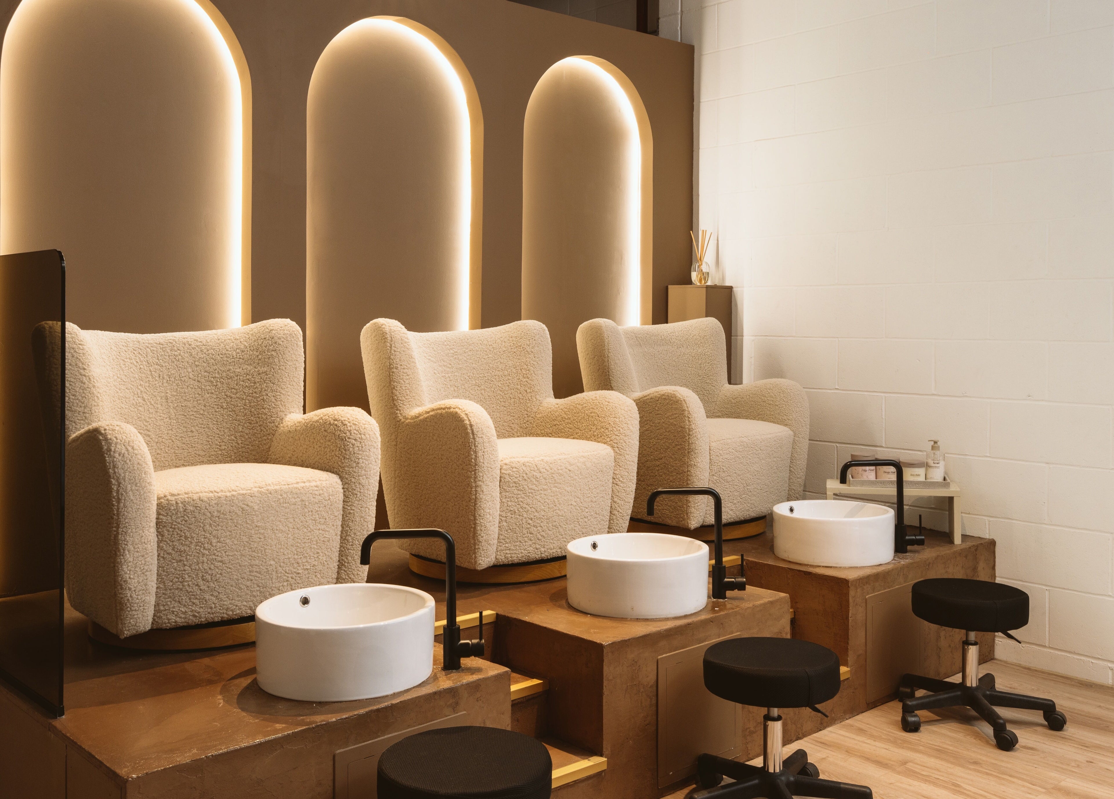 Elegant pedicure chairs at Awe London Canary Wharf, London, England, GB, designed for ultimate relaxation.