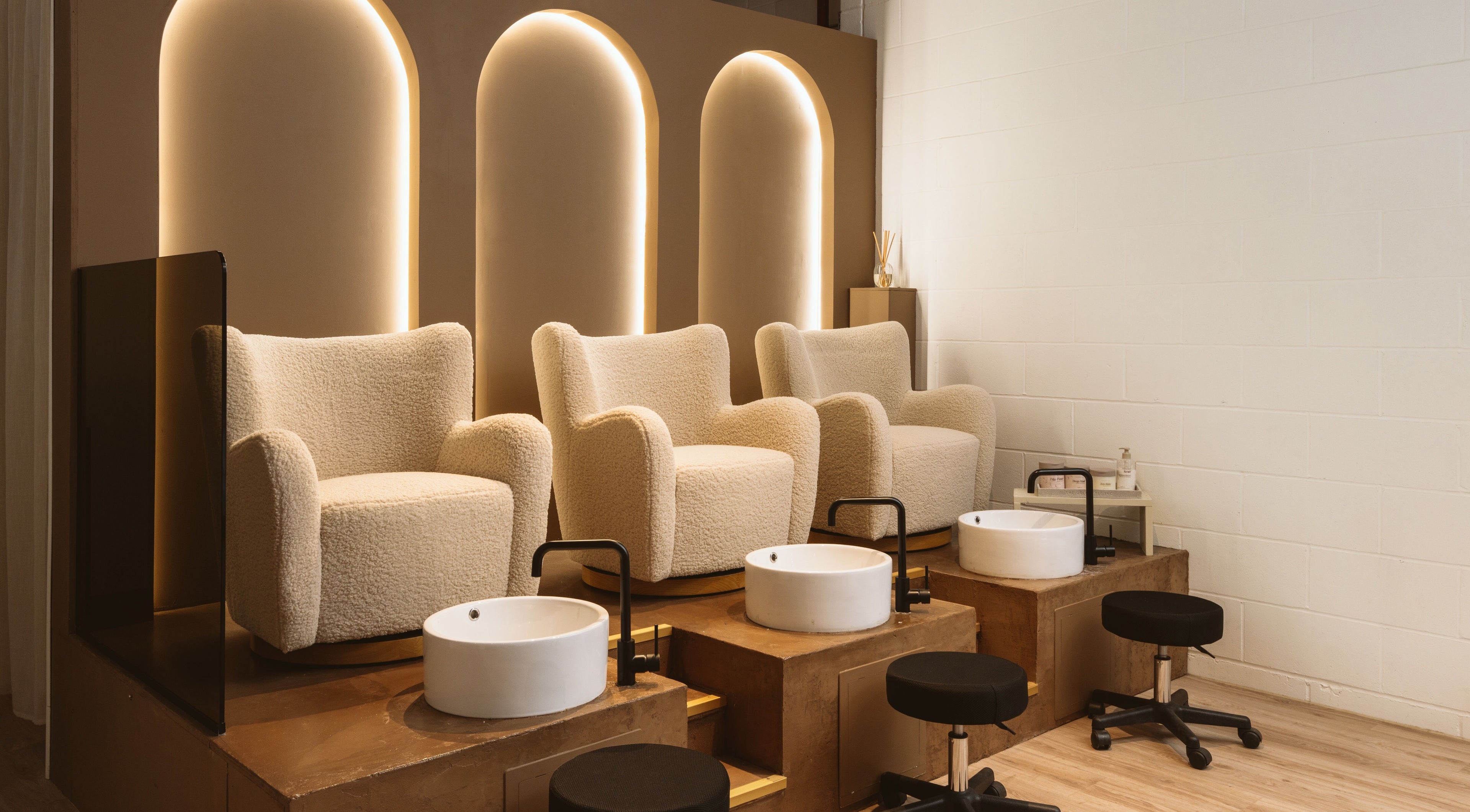 Elegant pedicure chairs at Awe London Canary Wharf, London, England, GB, designed for ultimate relaxation.