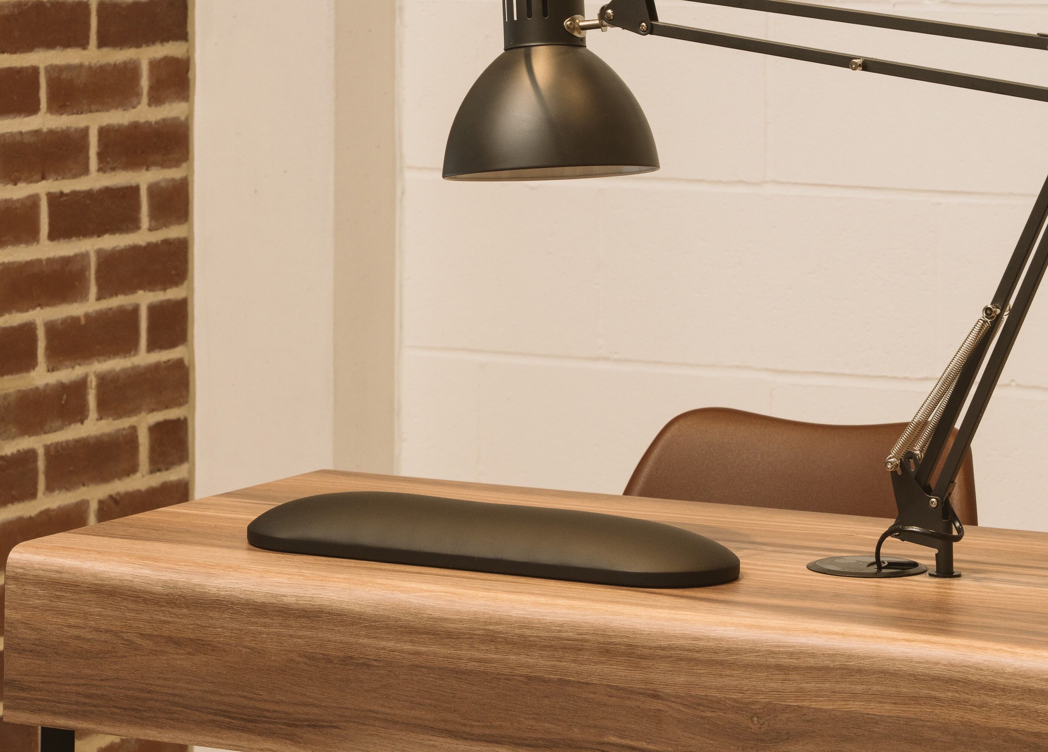 Sleek desk and lamp at Awe London Canary Wharf, London, England, GB highlighting a modern workspace.