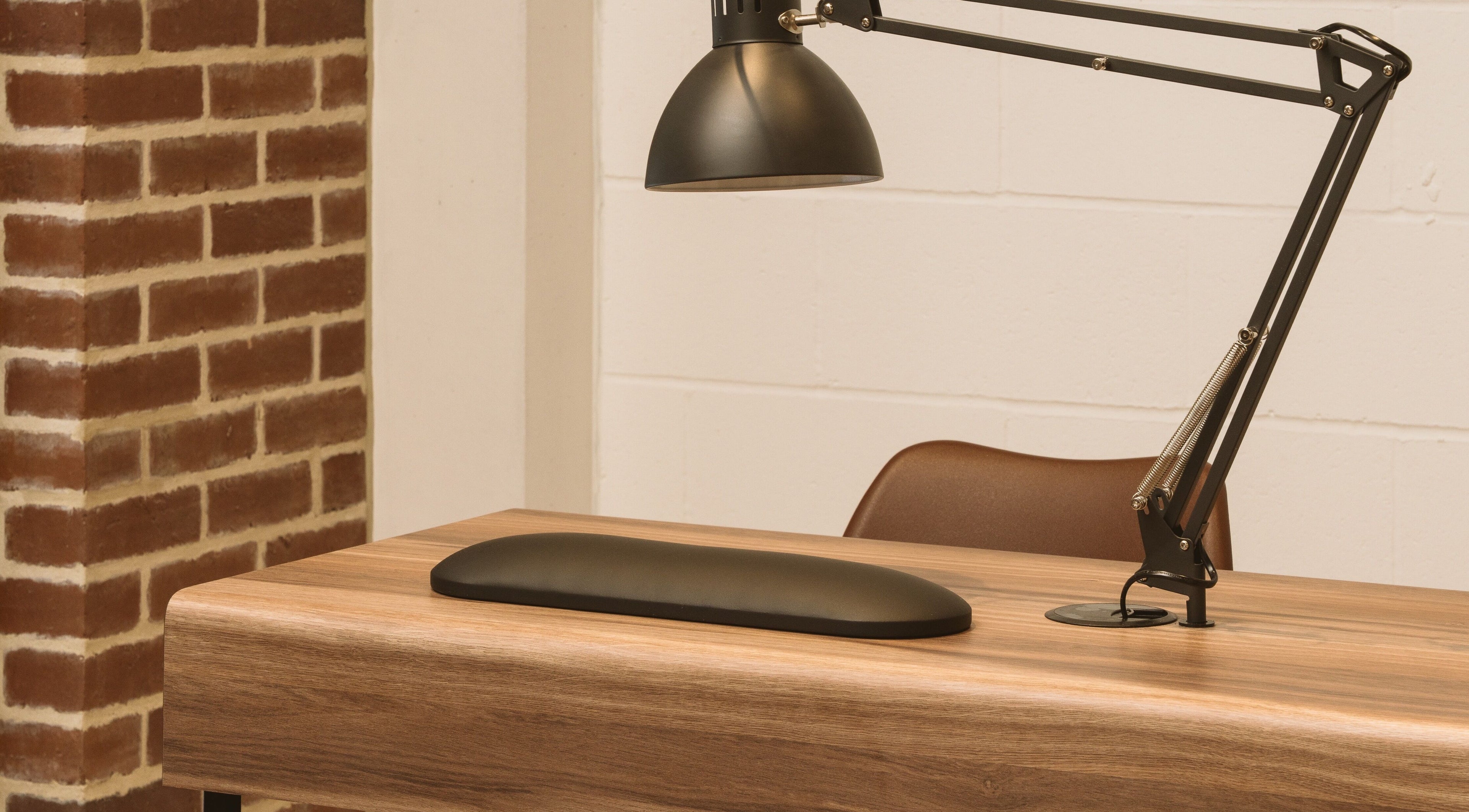 Sleek desk and lamp at Awe London Canary Wharf, London, England, GB highlighting a modern workspace.