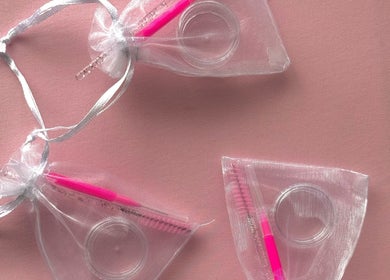 Lash and brow kits by The Mobile Lash and Brow Studio, Bundeena, New South Wales, AU on a pink background.