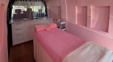 Luxurious interior of The Mobile Lash and Brow Studio, Engadine, New South Wales, AU, with a pink treatment bed.