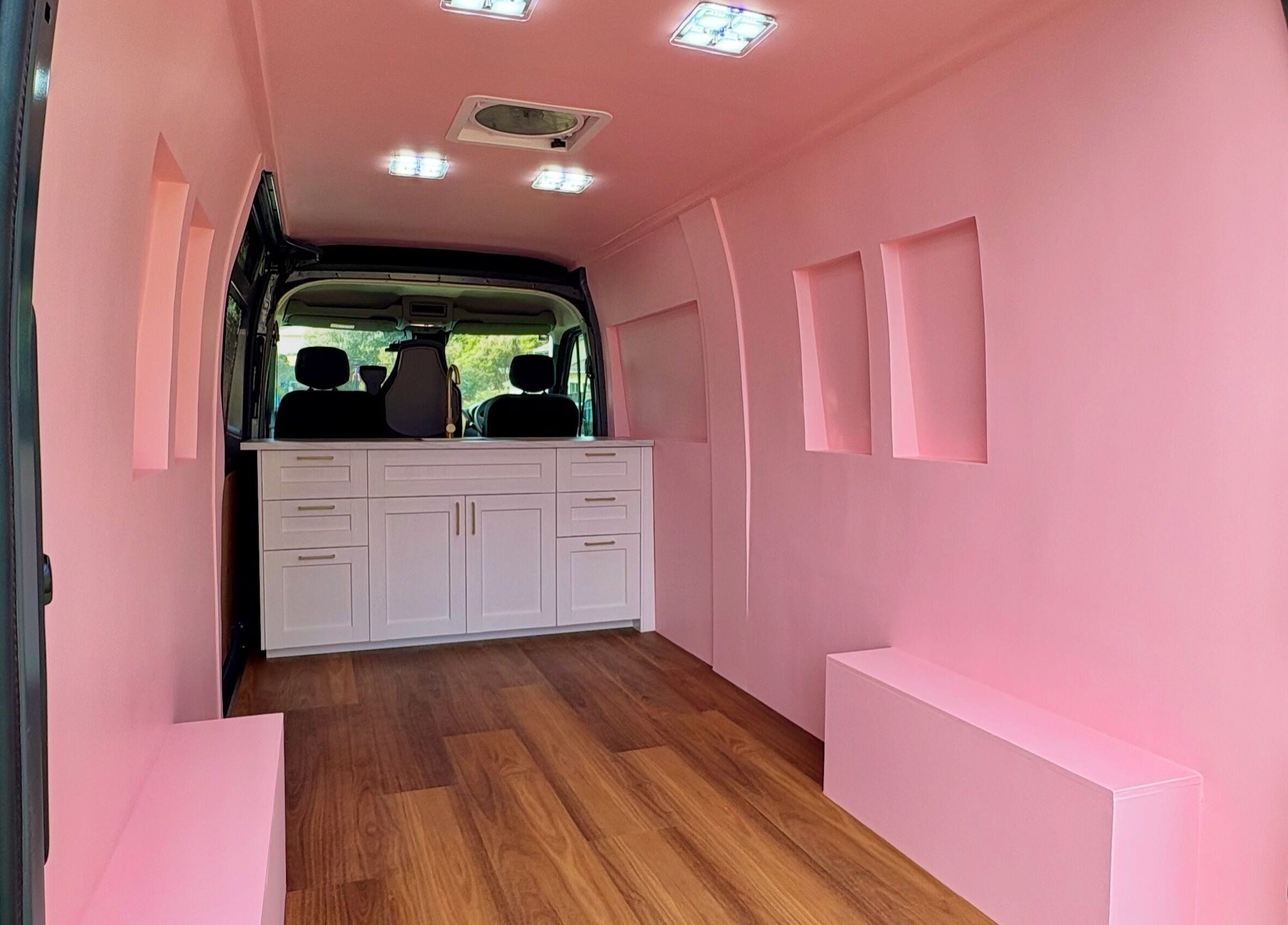 Inside view of The Mobile Lash and Brow Studio van with pink interior, Engadine, New South Wales, AU.