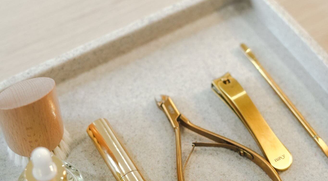Golden grooming tools at Atelier Evie in Bawtry, England, GB. Enhance beauty naturally.