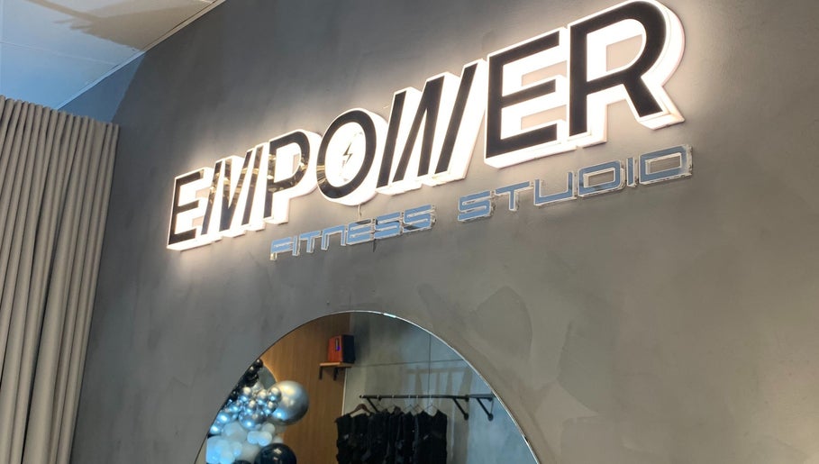 Illuminated sign of Empower Fitness Studio | BGC, Taguig City, Metro Manila, PH enhances modern interior decor.