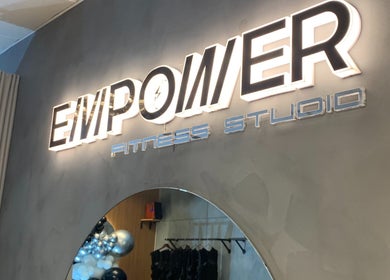 Illuminated sign of Empower Fitness Studio | BGC, Taguig City, Metro Manila, PH enhances modern interior decor.