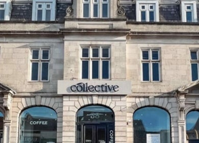 Historic building housing Precision Sports Therapy in Portsmouth, England, GB with elegant stone facade.