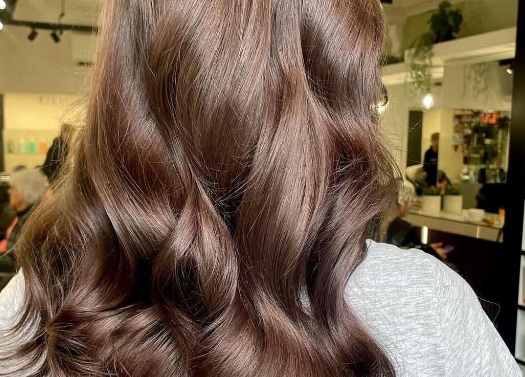 Beautiful wavy brown hair styled at James Fulton Hair in Newcastle upon Tyne, England, GB salon interior.