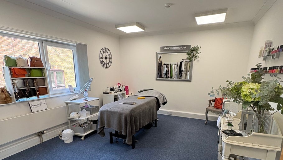 Spacious treatment room at AmBhar Aesthetics, Hockley Heath, England, GB, showcasing a tranquil, modern design.