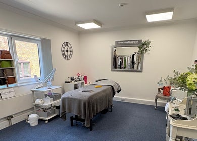 Spacious treatment room at AmBhar Aesthetics, Hockley Heath, England, GB, showcasing a tranquil, modern design.