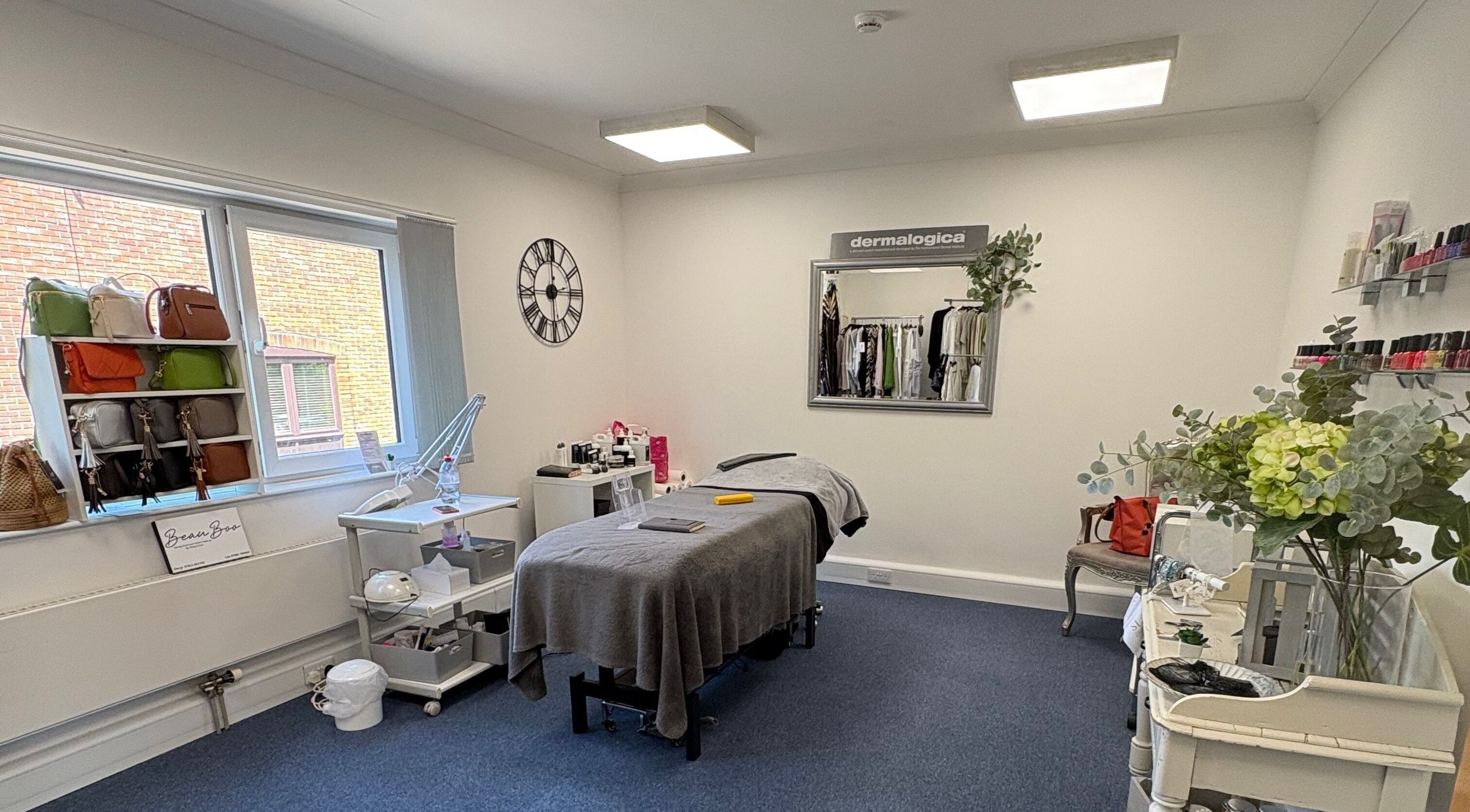 Relaxing treatment room at AmBhar Aesthetics, Hockley Heath, England, GB, featuring a massage table and elegant decor.