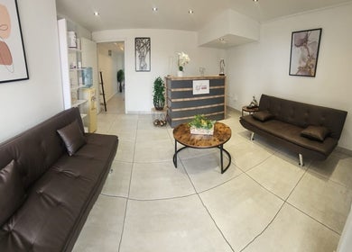 Chic reception area at Pink Orchard Aesthetics in Cape Town, Western Cape, ZA with modern decor.